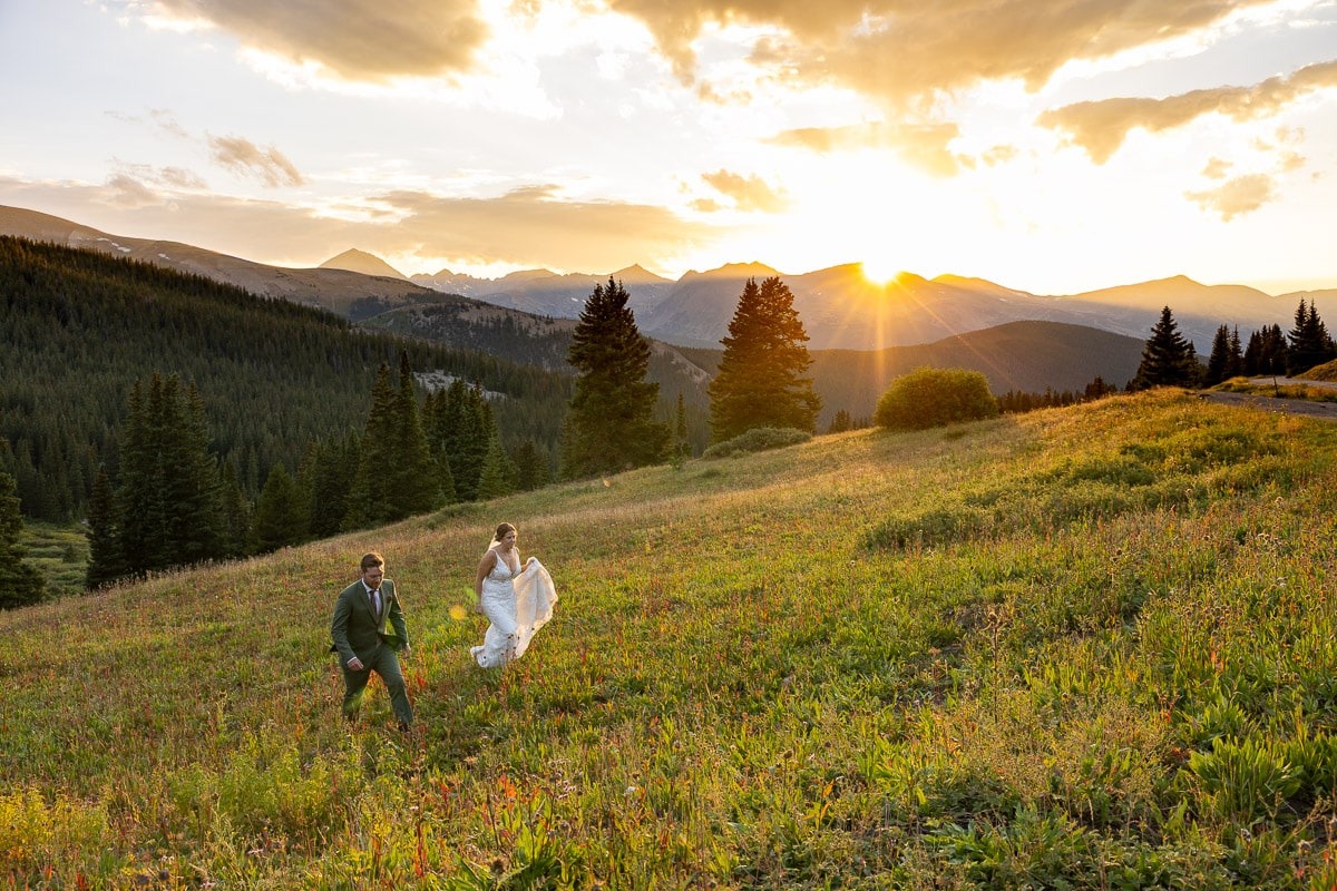 Bride and Groom in mountains with sunset
